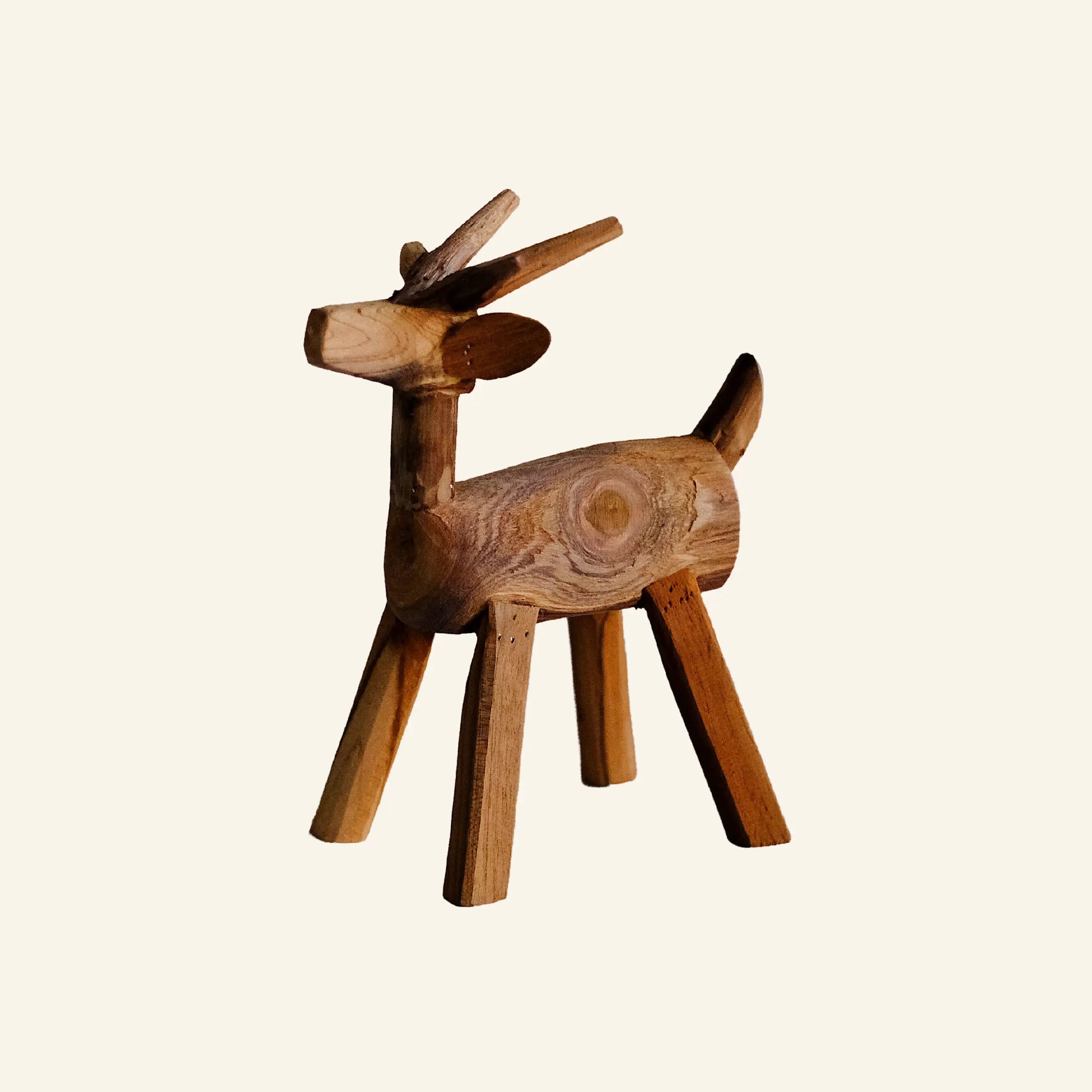 Wooden deer and teak roots
