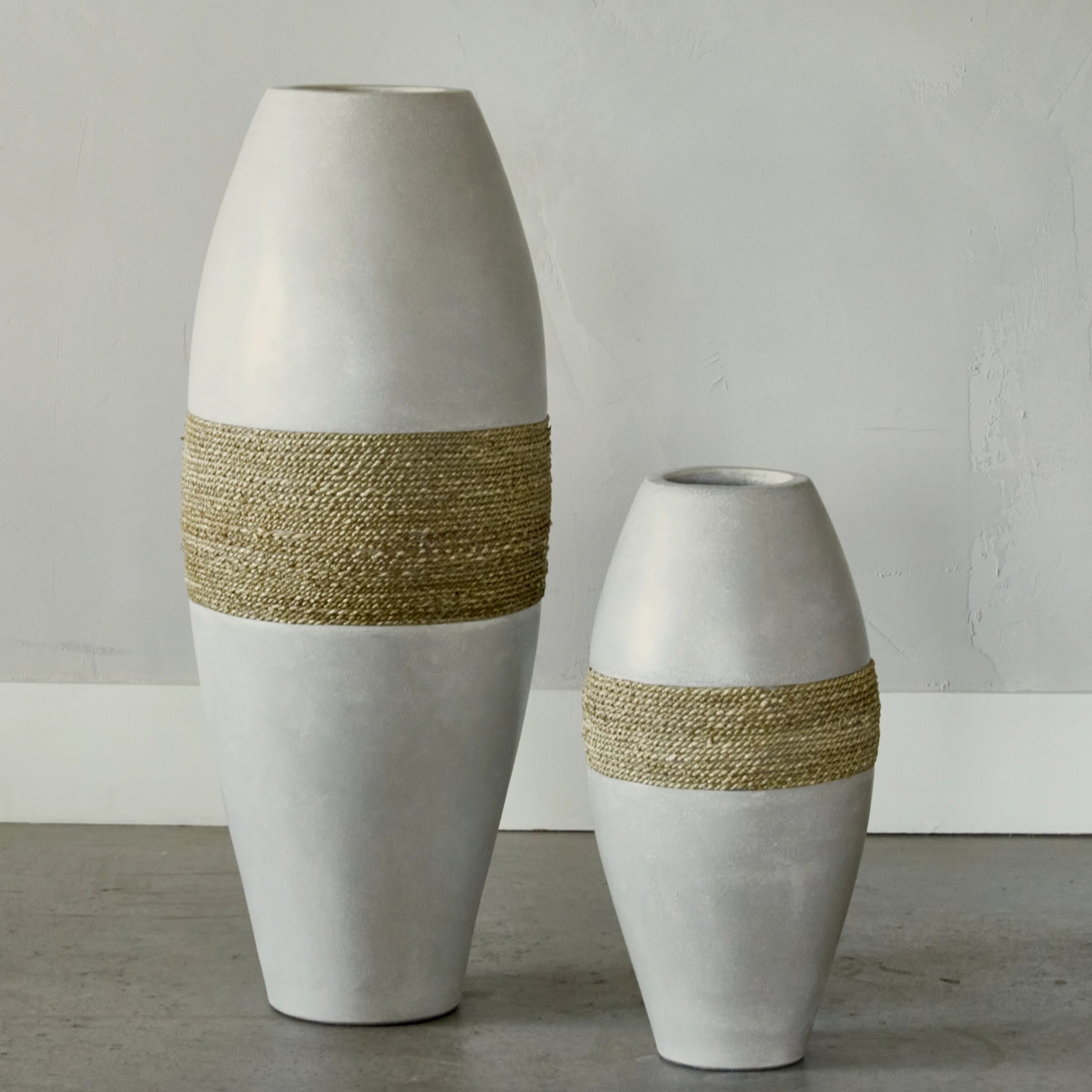 Large decorative cement and seagrass vase