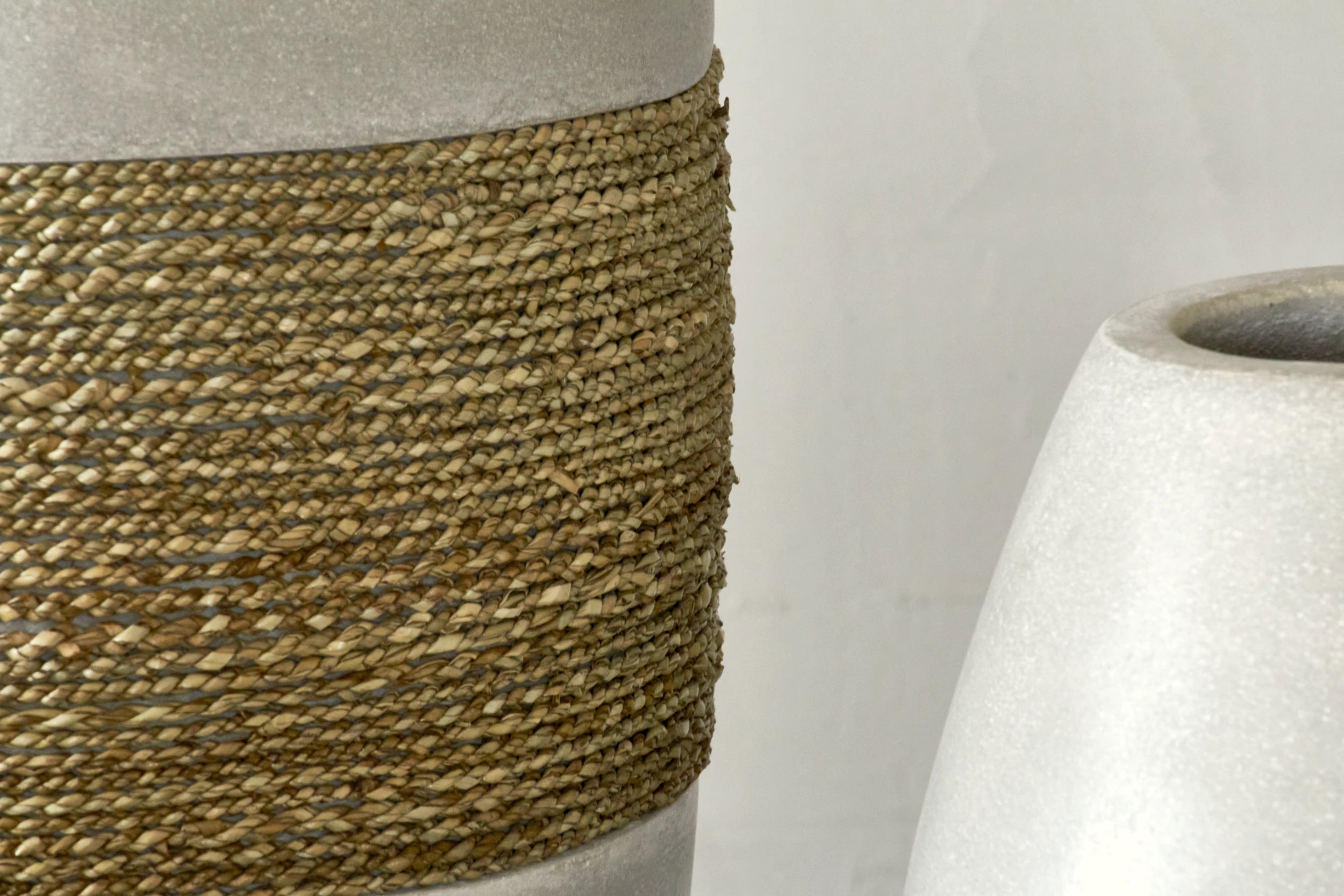 Large decorative cement and seagrass vase