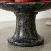 CRUSOË black marble pedestal cake stand with a unique speckled pattern, perfect for serving or display.